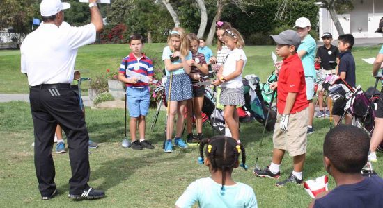 Kids watching the golf instructor